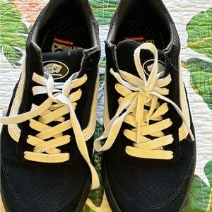 Vans Black Low-Top Sneakers with White Stripe and Laces